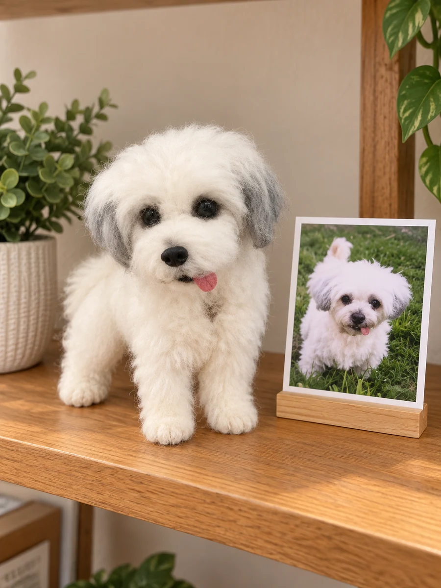 White and gray wool dog sculpture beside its original pet photograph